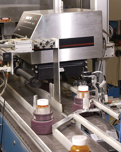This induction sealer's coil design helps to control the direction of the electromagnetic energy that's given off during the ind