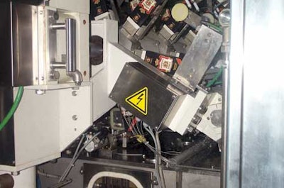 Carton blanks are opened and bottom-sealed on each of the six mandrels on a wheel within the aseptic machine. This occurs in thr