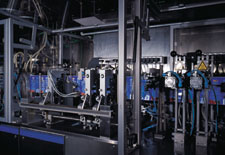 On the FBM 20 hf/f/s pouch machine, printed film is side-sealed (below left) as it indexes from left to right. In the 'duplex' m