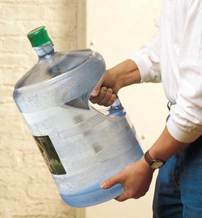 Perrier's 5-gal handled bottle gives consumers a better grip (top). A new modular rack system (above) cradles the bottles and pr