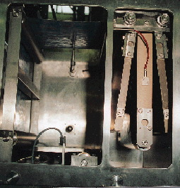 The sterile bath for the lidding material, shown here with the door open, is normally filled with a water solution that?s 35% H2