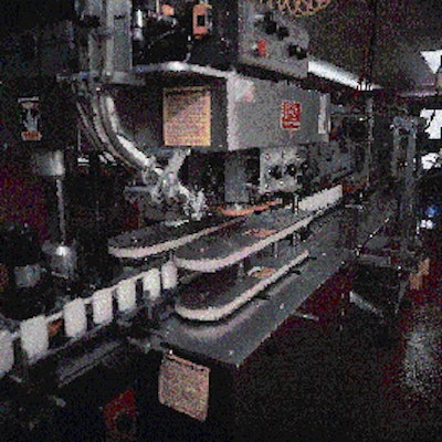 After discharging from the liquid nitrogen chiller, deodorant containers index to this capper for application of polypropylene c