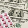 Pills on money background