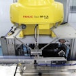 This photo shows a high-speed delta robot that uses a vacuum end-of-arm tool to pick up individual diagnostic test kits and feed them to a flow wrapper.