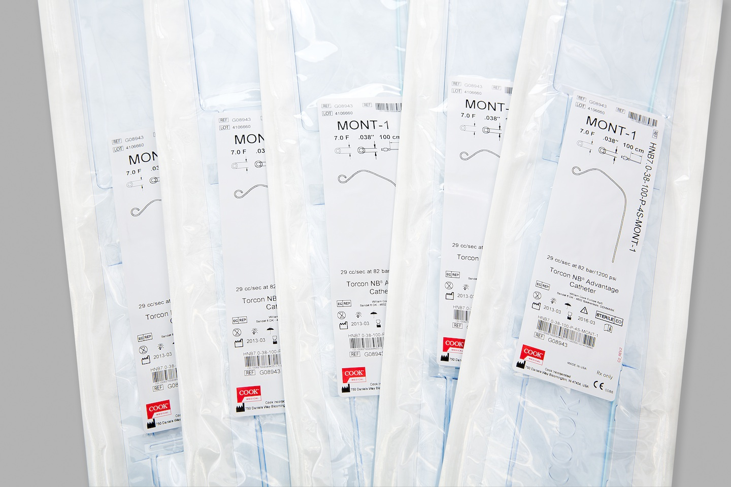 This photo shows five packs of Cook Medical products.