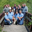 ‘BRIDGING’ THE SKILLS GAP. Representatives from the three organizations involved in developing the apprenticeship program join the first four apprentices on the bridge that connects Bosch’s New Richmond, WI, facility grounds and the Wisconsin Indianhead Technical College campus. Back row L-R: Nancy Cerritos (WITC); Kevin Lipsky (WITC); Pres Lawhon (Bosch); Olaf Wick (WITC); Randy Deli (WITC). Middle row L-R: Travis Ludvigson, (State of Wisconsin Bureau of Apprenticeship Standards); Alexandra Nungesser (Bosch); Ashley Bauman (Bosch); Chris Jehle (Bosch); Mark Hanson (Bosch). Front row L-R: Brant Couch, Philip Taylor, Paul Petty, and Josh Marquand.