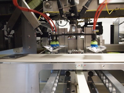 TWO POUCHES. Two unoriented pouches are picked up by an AFA Delta 3 robot, which then places them into a loading funnel.
