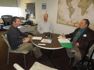 From left to right, Zachary Brousseau and Matthew A. Clark of the Regulatory Affairs Professional Society speak with Jim Butschli, Healthcare Packaging Editor.