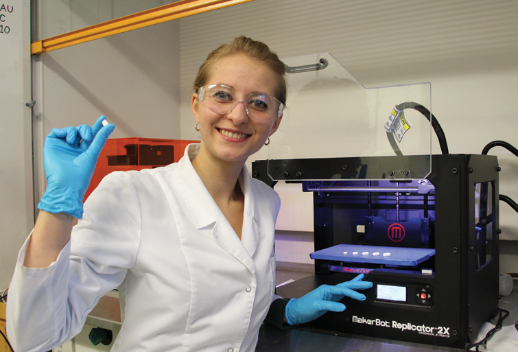 PERSONALIZED MEDICINE. Britain&rsquo;s University of Central Lancashire is developing a 3D printer that can produce a tablet with precise drug quantities of meds for individuals. Here, student Katazyna Pietrzak holds a 3D-printed theophylline tablet made of 100% pharmaceutical-grade materials