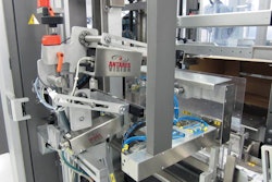 INBOUND CARTONS. As cartons visible in the lower right corner are conveyed into a case packer, a camera reads all 100 unique car