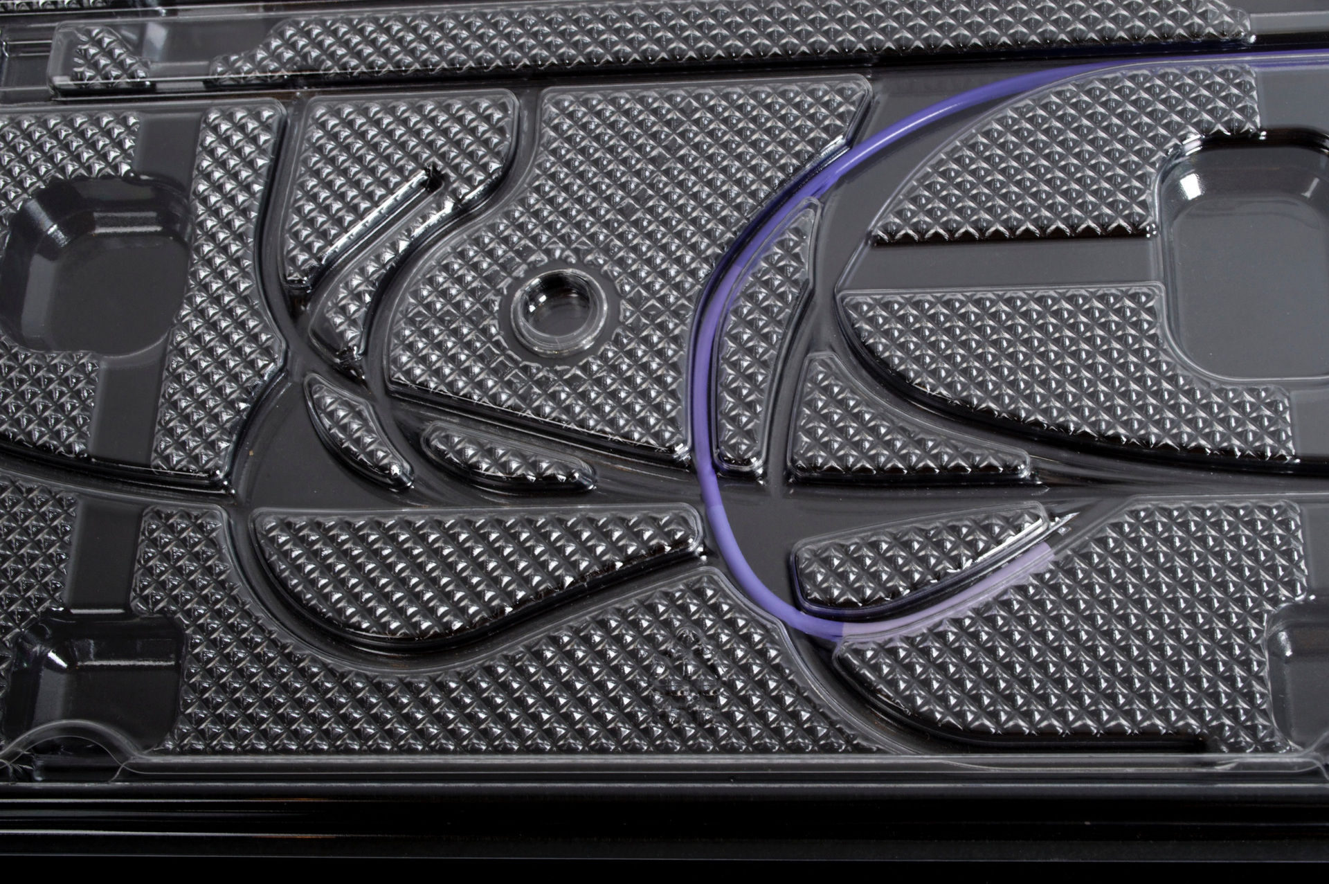 CURVE PATTERN. The curve features aided retention of the curve in the devices during sterilization process.