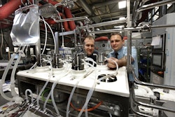 With the Bosch filling line, Boehringer Ingelheim can fill and close up to 400 containers/min, ranging from vials to single and double-chamber cartridges. Here, workers check the disposable tubes of the filling system.