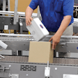 An ergonomic hand-pack station eases manual case packaging applications.