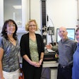 From left to right, Gina Maroney, Corinne McGill, Dale Marcuccilli, and Laure Larkin around the Instron machine set up for a lid tensile test. (Missing: Binal Shah).