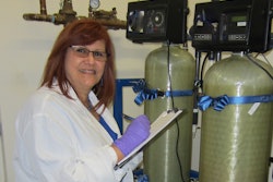 Ivette Larralde-Valdes conducts auditing of a microbiology water sample at the Purified Water System Utility area.