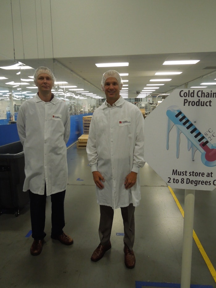 PCI’s Justin Schroeder (right), Executive Director, Marketing, Business Development & Design, and from Ray Hook, Senior Manager, Global Serialization Services.