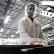Packaging product within a cleanroom at Millstone Medical Outsourcing.