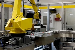 Fanuc robotic arm presenting camera with bottles.