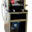 Lab-scale tabletop blister packaging machine includes material autofeed; ideal for low-volume packaging needs.