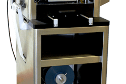 Lab-scale tabletop blister packaging machine includes material autofeed; ideal for low-volume packaging needs.