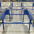 Multi-strand auto pick conveyor is designed to convey corrugated cases containing stacked heavy metal products.