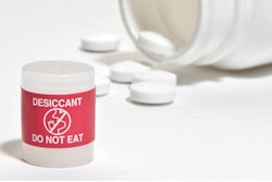Red labels help differentiate desiccant from the drug product; only FDA- and EU-compliant materials are used.
