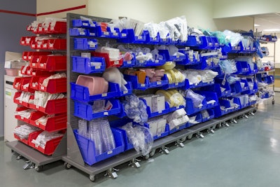 Midwestern medical system’s dolly from Akro-Mils eases logistics of moving supply racks within multiple departments; helps workers identify what is in the bin, scan a label or restock the bin.