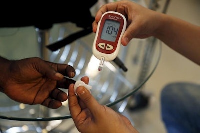 Blood Sugar Test at SS Diabetes care clinic / Photo: REUTERS/Beawiharta