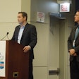 Optel Vision's Mario Simard (at podium) and Steve Peterson co-presented 'Serialization-Regulatory Compliance' on Tuesday, Nov. 8