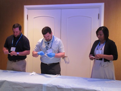 The nurses and technicians panel is an annual highlight of HealthPack. Here, thee professionals from a recent show are shown reviewing medical device packages for examination.