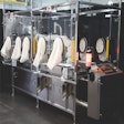 TaskMate® system integrates FANUC clean class robots with RABSeEnclosures to create a sterile automated filling and capping system for syringes.