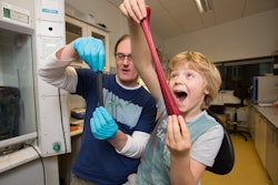 Coleman and his son play with his new invention. / Photo: Trinity College Dublin