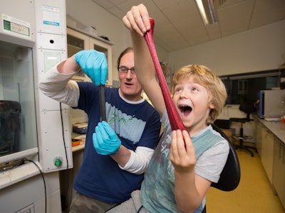 Coleman and his son play with his new invention. / Photo: Trinity College Dublin