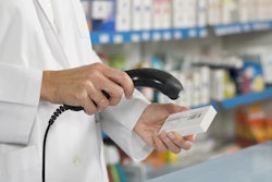 This image shows a healthcare professional scanning a barcode.