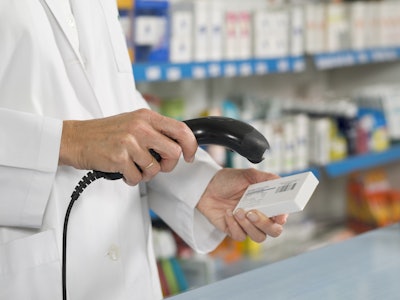 This image shows a healthcare professional scanning a barcode.
