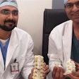 Dr. Kumar and Dr. Naik with 3D printed titanium vertebrae implant. / Photo: 3Ders