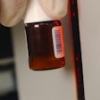 Shown here is a TEKLYNX vial scanner in use.