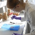 Emilia Hevelke prepares samples for testing in Smithers’ analytical chemistry laboratory in Leatherhead, U.K.