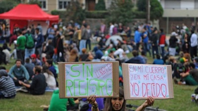 A protester against the marijuana registry. / Image: Getty Images