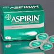 Shown here is Bayer’s Shamrock aspirin pack next to its outer folding carton.