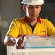 An operator packs a temperature-controlled shipment.