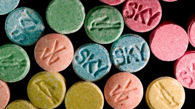 MDMA is better known as the party drug ecstasy. / Image: Science Mag