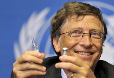 Bill Gates holding a vaccine. / Image: The Guardian