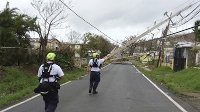 Workers restoring power in Puerto Rico. / Image: FiercePharma