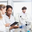 Researchers at work in lab.