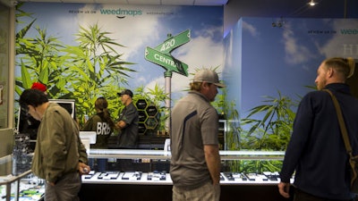 Customers at 420 Central, a marijuana dispensary in Santa Ana, on New Year's Eve. (Kent Nishimura / Los Angeles Times)