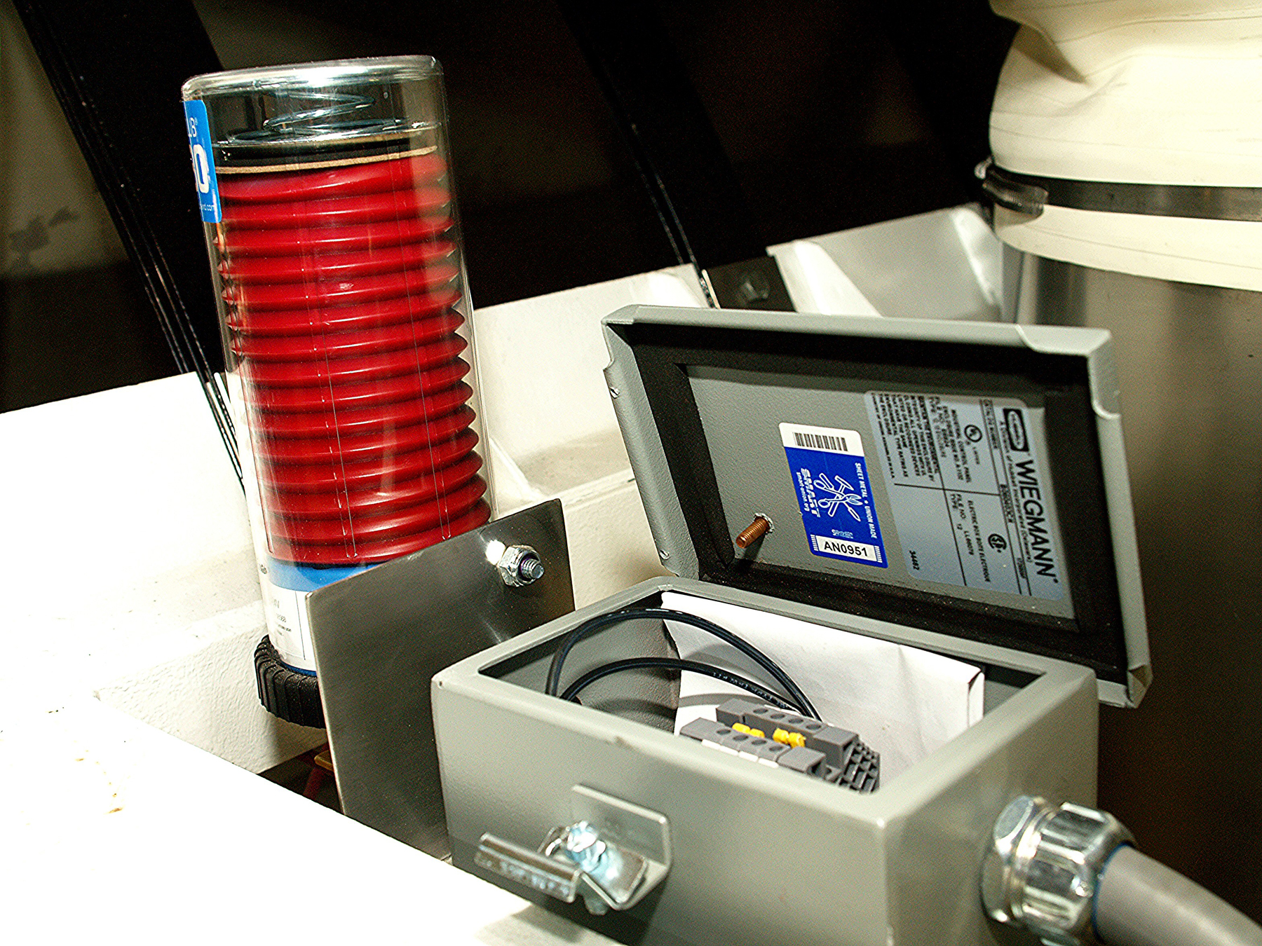 Dryers and coolers include automated greasing system