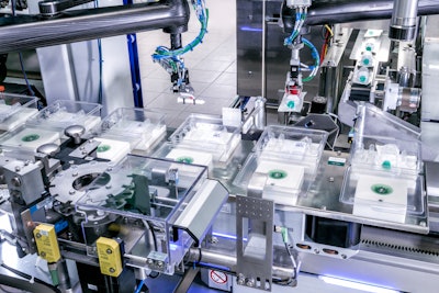 An F4 pick-and-place robot takes the suspended piston rods from the starwheel. With a horizontal tilting motion, the robot places the piston rods. (Photo provided by Schubert-Pharma.)