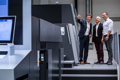 Rondo AG is conducting what is reported as the world's first pharmaceutical packaging beta test with the Heidelberg Primefire 106, shown here with Joachim Hoeltz (left), CEO Rondo AG and Giovanni De Luca (right), Director Operations Switzerland Rondo AG, as well as Philippe Andrey of Heidelberg Switzerland.