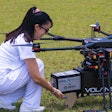 A Merck medication treatment is loaded into a drone for delivery during the “Proof of Concept” project.